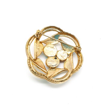 Ronde goudkleurige 80s broche met rode groene en blauwe steen en email