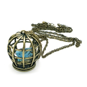 Avon bronskleurige ketting met turquoiseblauw vogeltje in kooitje