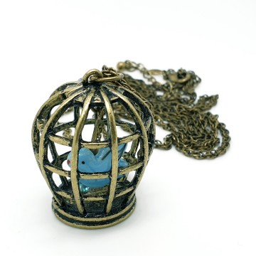 Avon ketting met turquoiseblauw vogeltje in kooitje