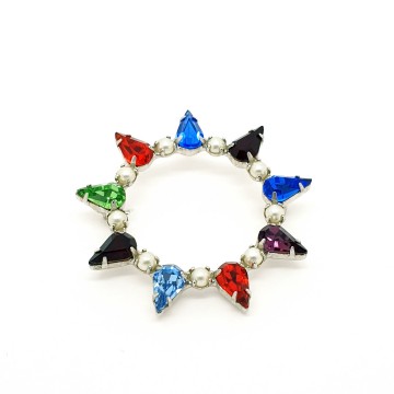 B. David round silvertone multicoloured brooch