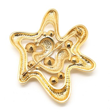 Big shiny goldtone star shaped brooch with clear rhinestones 80s - Bliinkt