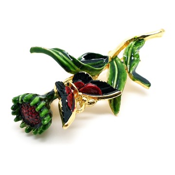 Bloembroche met vlinder groen rood emaille