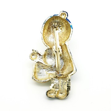 Blue and white enamel drummer boy broche back