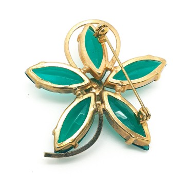 Goldtone flower brooch with unfoiled emerald green navette shaped glass stones and ab rhinestone 40s - Bliinkt