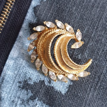 BSK goldtone brooch with facetted clear navette rhinestones