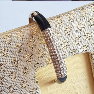 Camille Lucie goldtone bangle with black enamel and clear rhinestones