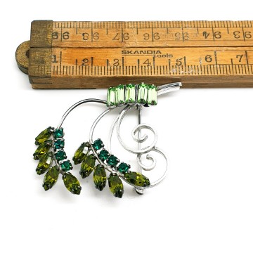 CC sterling brooch with green rhinestones