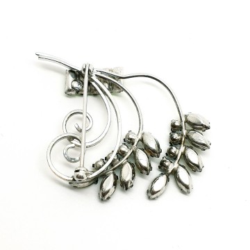 CC sterling brooch with green rhinestones