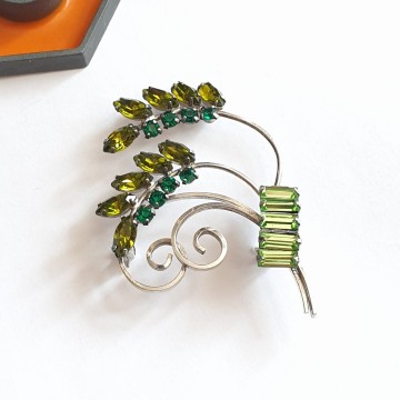 CC sterling brooch with green rhinestones