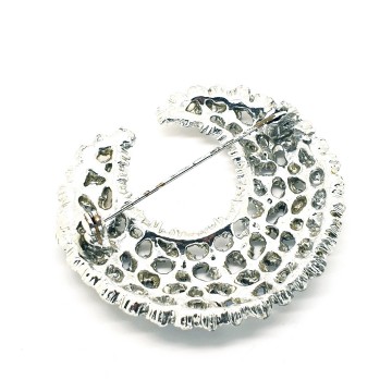 Crescent shaped silvertone brooch with red aurora borealis rhinestones - Bliinkt