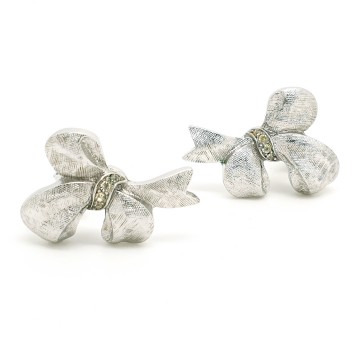 Crown trifari brushed silvertone bow earrings with clear rhinestones