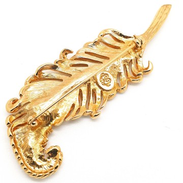 Crystaline - goldtone feather brooch with clear crystals and amber coloured teardrop shaped rhinestone - Bliinkt