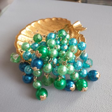 Dangle brooch with different shades blue and green beads