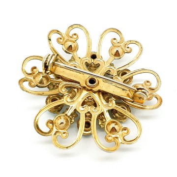 Flower shaped goldtone brooch with turquoise rhinestones and virgin