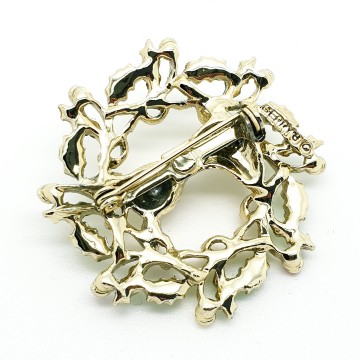 Gerrys goldtone Christmas wreath brooch with green enamel leaves and a deer with blue rhinestone eyes back