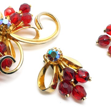 Goldtone brooch and earring set with red facetted beads