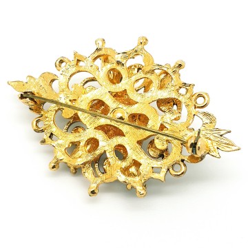 Goldtone brooch with red center rhinestone surrounded by green rhinestones - Bliinkt