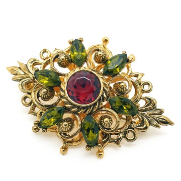 Goldtone brooch with red center rhinestone surrounded by green rhinestones - Bliinkt