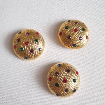 Goldtone dome shaped buttons with coloured rhinestones