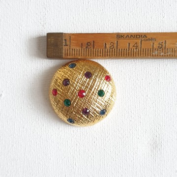 Goldtone dome shaped buttons with coloured rhinestones