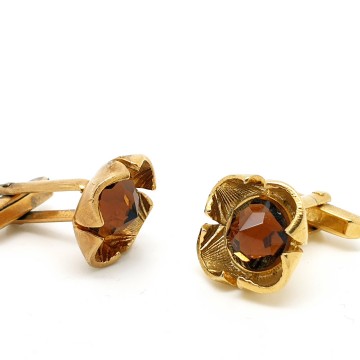 Goldtone cufflinks with facetted brown pyramid glass stone