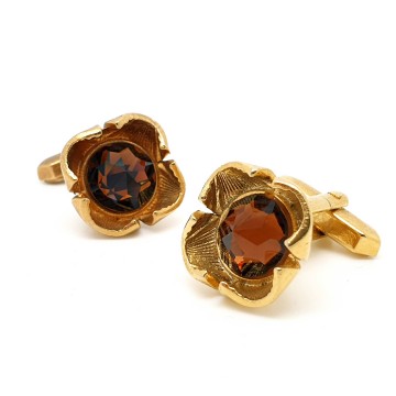 Goldtone cufflinks with facetted brown pyramid glass stone