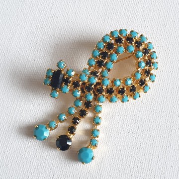 Goldtone dangle brooch with black and turquoise rhinestones