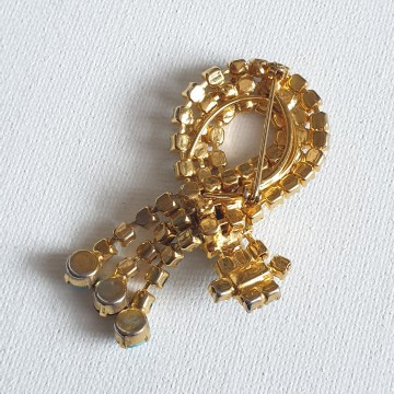 Goldtone dangle brooch with black and turquoise rhinestones