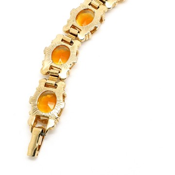 Goldtone link bracelet with clear and ocher faceted glass stones - Bliinkt