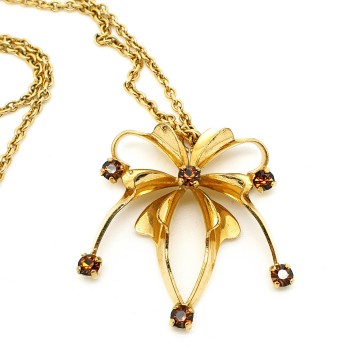 Goldtone necklace with spider pendant and amber rhinestones
