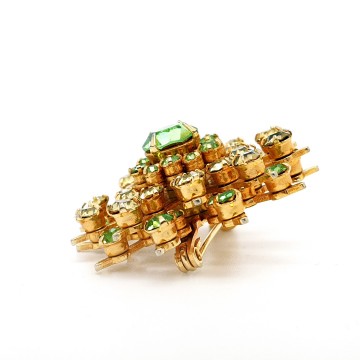 Goldtone snowflake brooch with clear green and soft yellow rhinestones