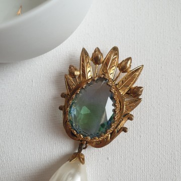 Goldtone brooch with blue stone and faux pearl