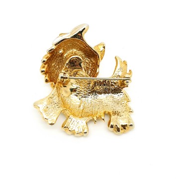 Goudkleurige 'Scottie' broche met wit emaille en groene strassoogjes