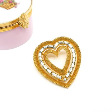 Goldtone heart brooch with baguette rhinestones