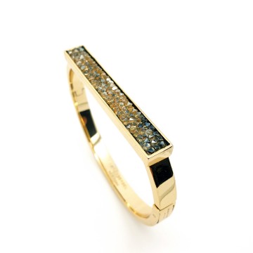 Henri Bendel New York goldtone bangle with black enamel and reversed rhinestones