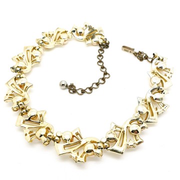 H&S licht goudkleurige ketting met champagnekleurige faux parels 50's