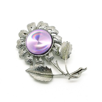 Jewelarama 60s brooch with lilac refractive center disc