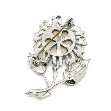 Jewelarama 60s brooch with lilac refractive center disc signed