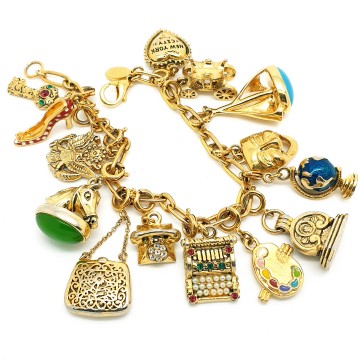 Joan Rivers - goldtone charm bracelet with 14 charms - Bliinkt