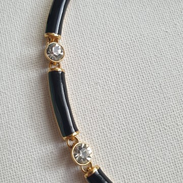 Short goldtone necklace with black enamel links and clear rhinestones signed N with crown - Bliinkt