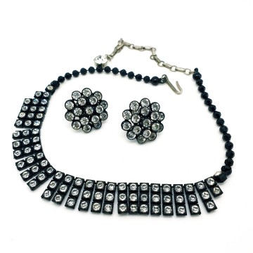 Round black plastic screw back earrings and necklace with clear rhinestones