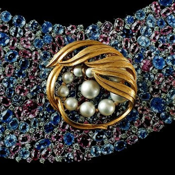 Kramer goudkleurige circelbroche met faux parels