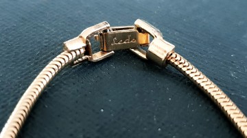 Ledo ketting klassieke goudkleurige strik met heldere strassstenen 50s slotje