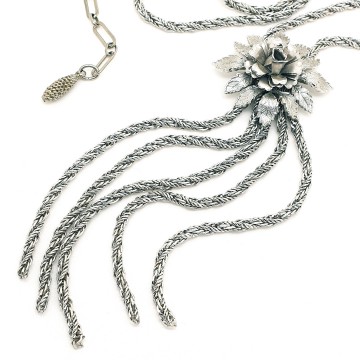 Long silvertone rope necklace with a floral centerpiece and multiple rope chain tassels - Bliinkt