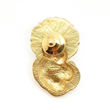 Madonna and child lapel pin by Avon 1993 goldtone with green enamel halo back