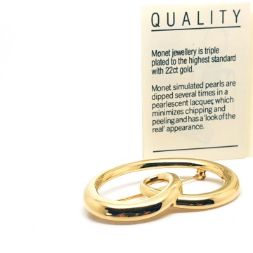Monet shiny goldtone pretzel shaped brooch - Bliinkt