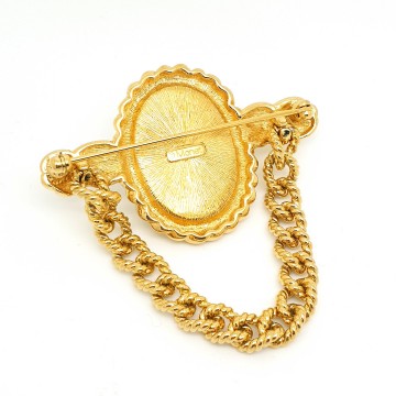 Monet goldtone dangle brooch with white cabochon - Bliinkt