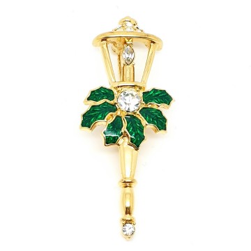 Monet - goldtone lantern brooch with clear strass and green enamel holly leaves - Bliinkt