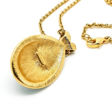 Monet long goldtone necklace with dark blue enamel pendant and faux center pearl