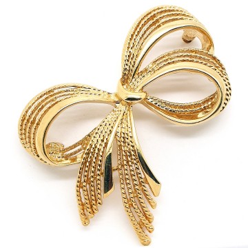 Napier - goldtone bow brooch - Bliinkt